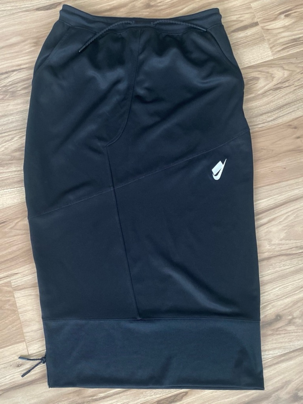 Nike Black Athletic Shorts with White Swoosh, pockets and slit zipper on side
